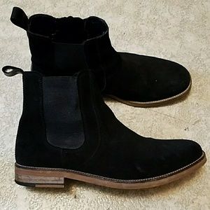 Black suede Chelsea boots.